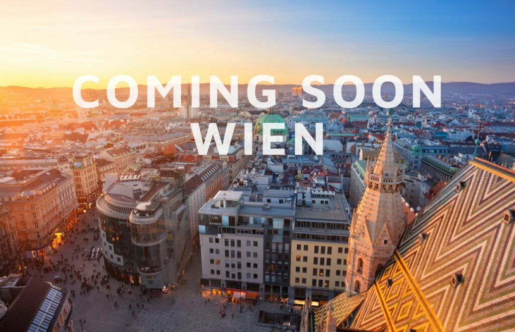 Das Foto zeigt Wien von oben und trägt die Aufschrift "coming soon Wien".